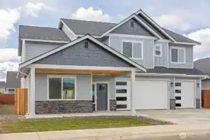 Newly built West Ridge home with contemporary design and spacious garage.