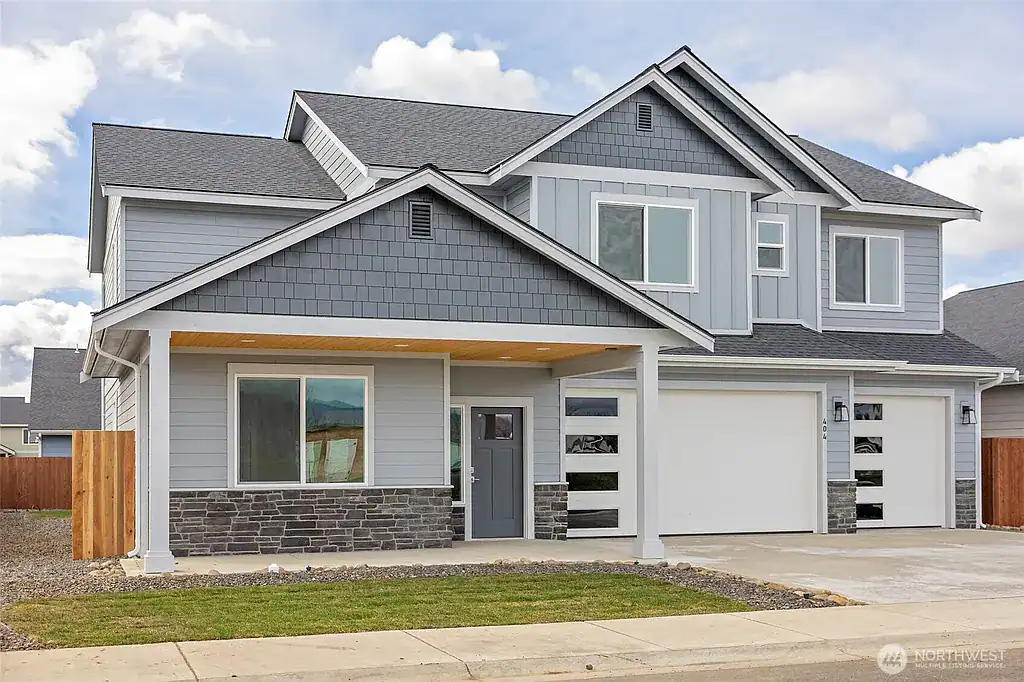 Newly built West Ridge home with contemporary design and spacious garage.